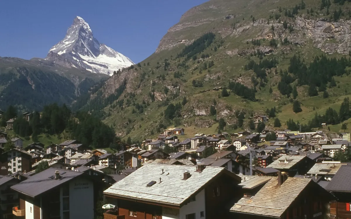 Chalet rooftops in Zermatt with the Matterhorn rising behind on a clear day Chalet rooftops in Zermatt with the Matterhorn rising behind on a clear day
