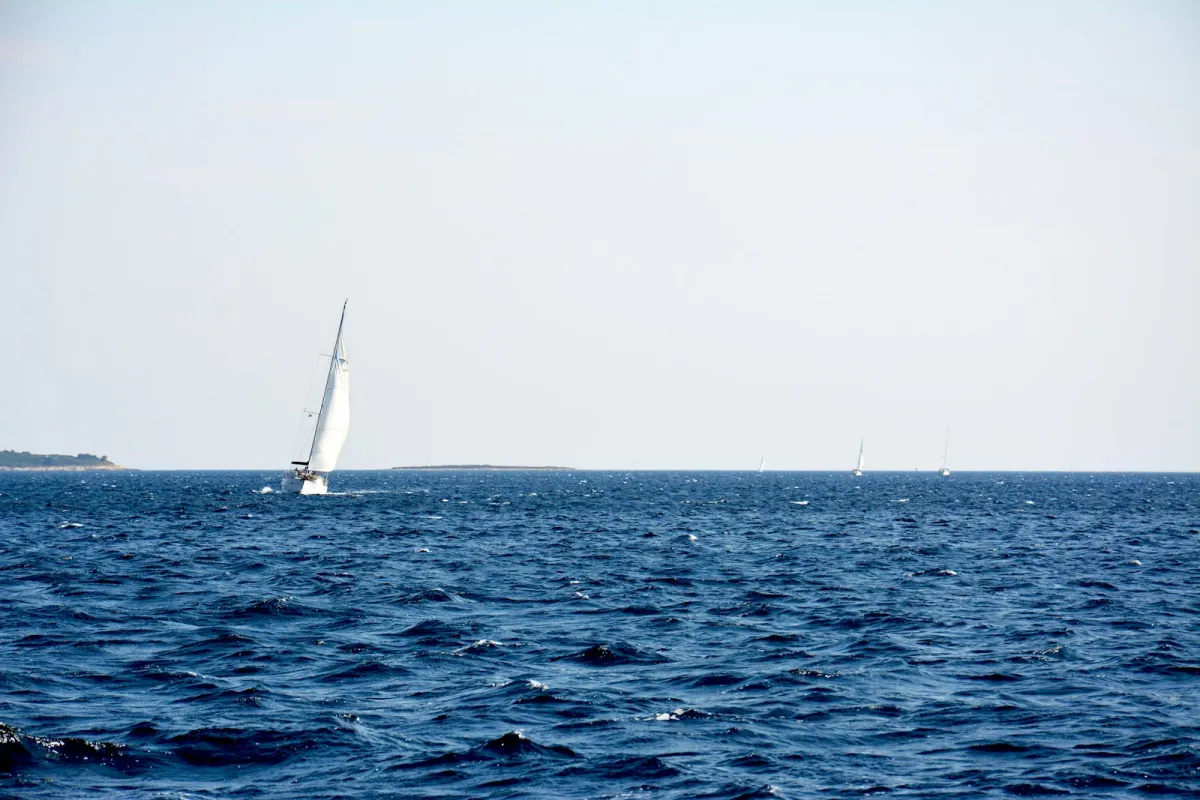 Sailing boat on the deep blue Adriatic Sea off the coast of Pula, Croatia