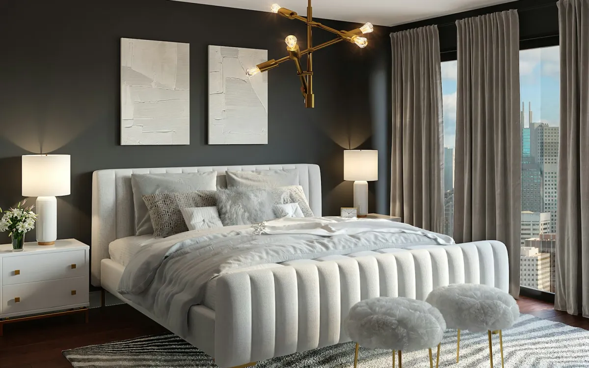 A modern bedroom with a white channel-tufted upholstered bed, bedside lamps and a city view