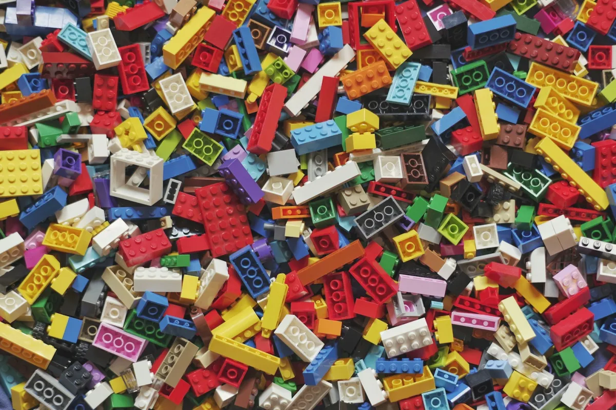 A heap of colourful plastic toy building bricks