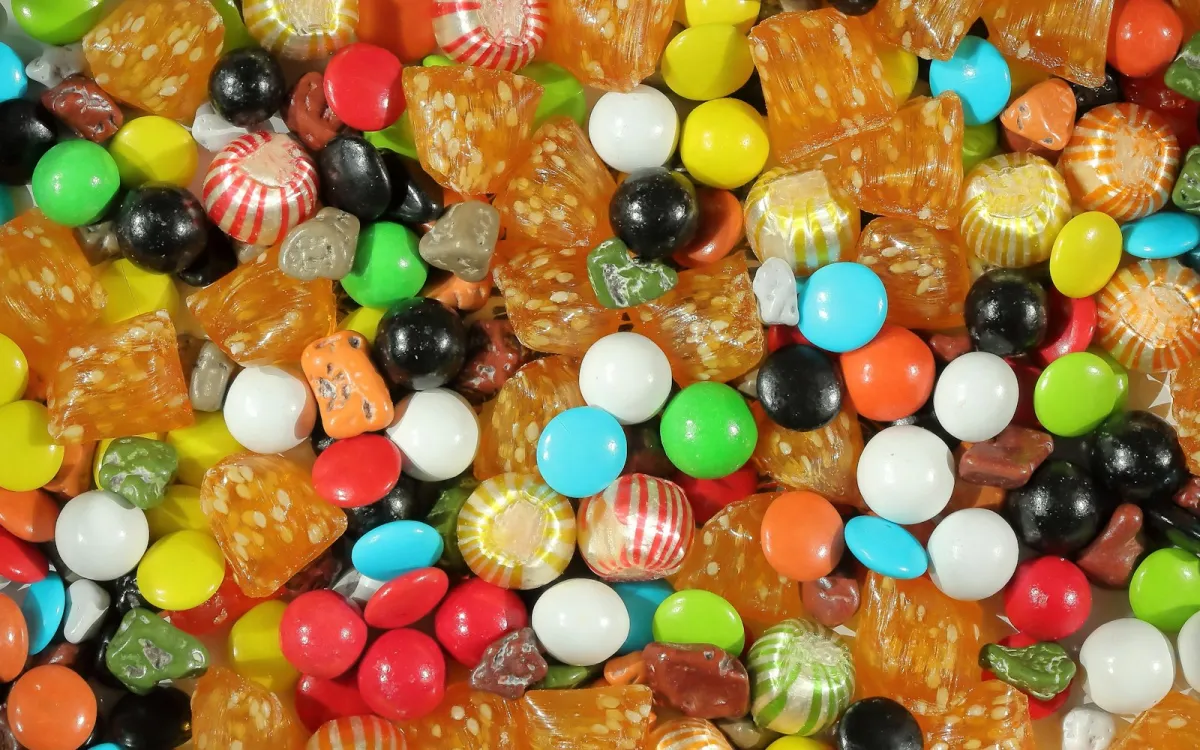 A colourful mix of boiled sweets, striped mints and sugar-coated chocolates