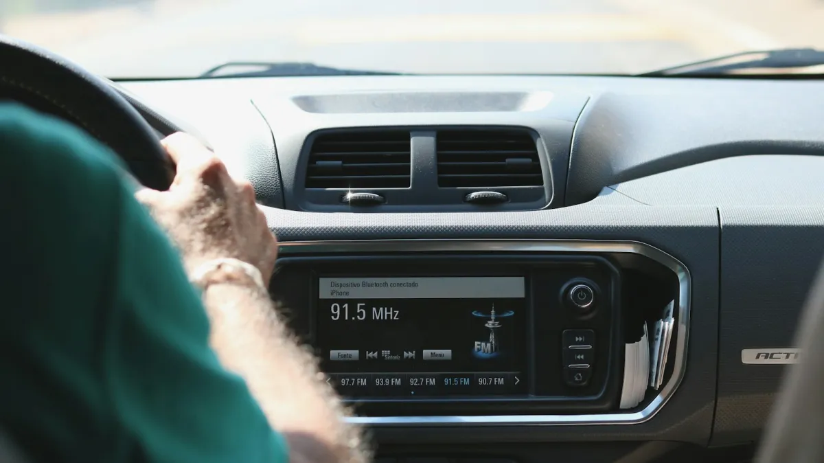 Driver's view of a car dashboard with a touchscreen radio
