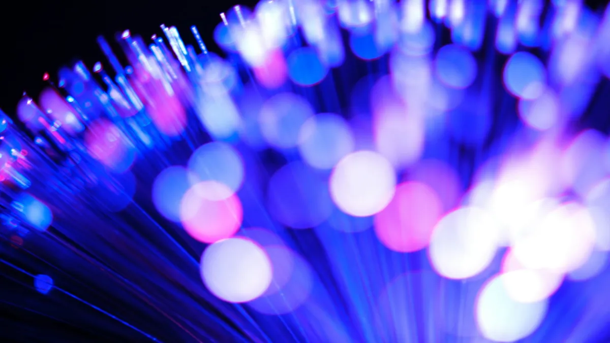Glowing blue and pink fibre optic cable ends Glowing blue and pink fibre optic cable ends