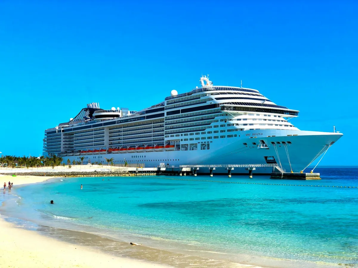White cruise ship at sea on a clear day