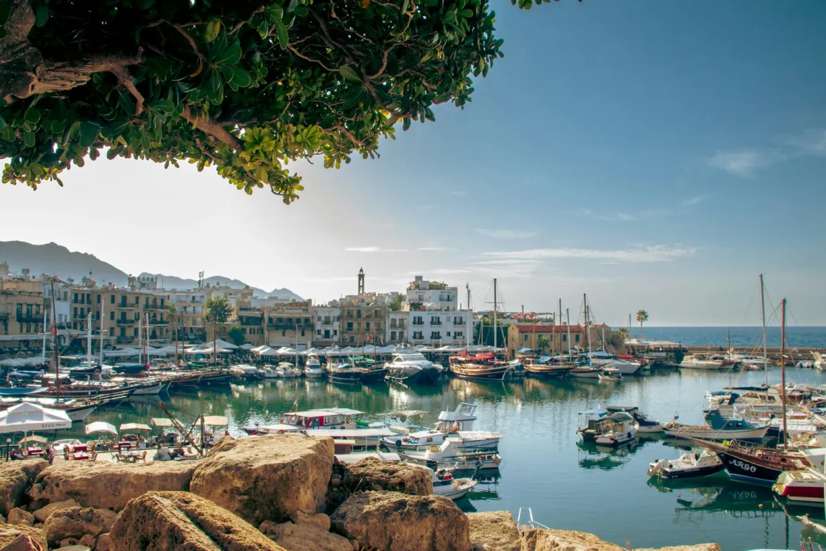 Boats moored in Kyrenia harbour, North Cyprus, with mountains behind the old town Boats moored in Kyrenia harbour, North Cyprus, with mountains behind the old town