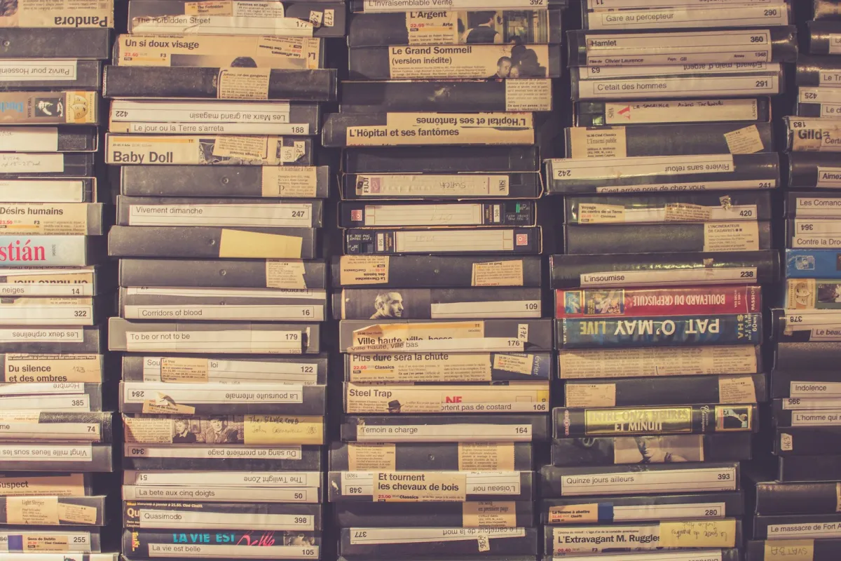 Stacks of old VHS video tapes with handwritten labels Stacks of old VHS video tapes with handwritten labels