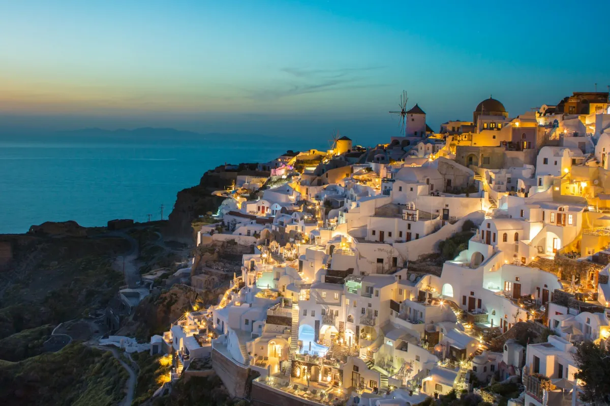 White clifftop buildings in Oia, Santorini, in evening light