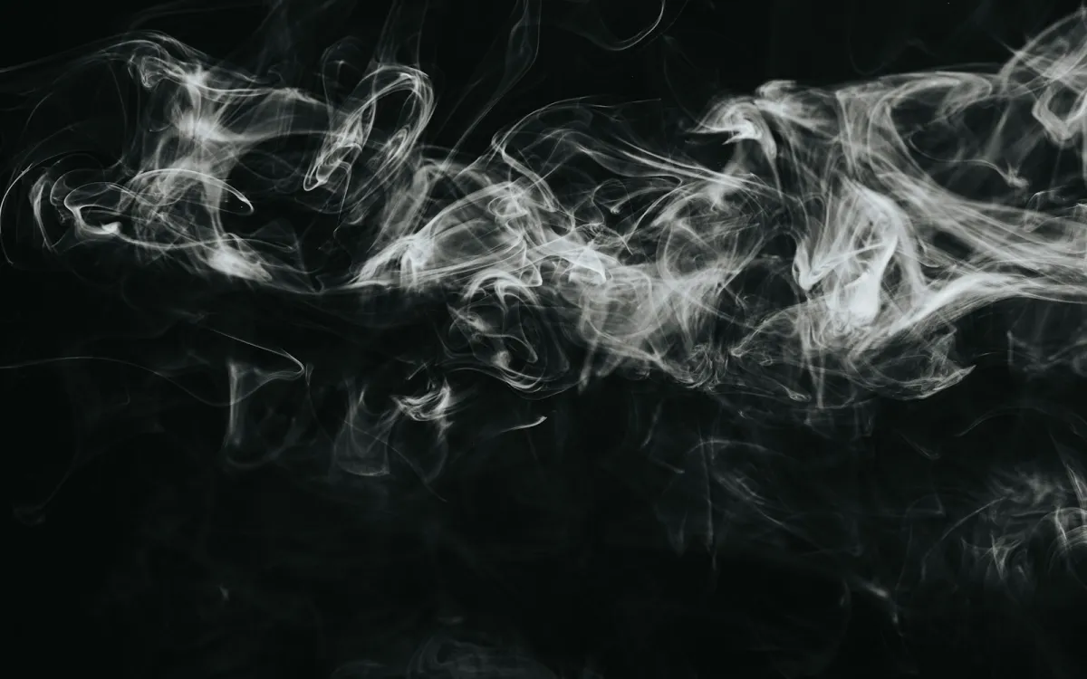 Wisps of white vapour against a black background Wisps of white vapour against a black background