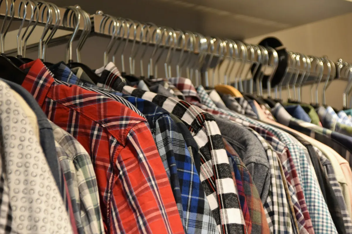 A rail of men's checked shirts on hangers