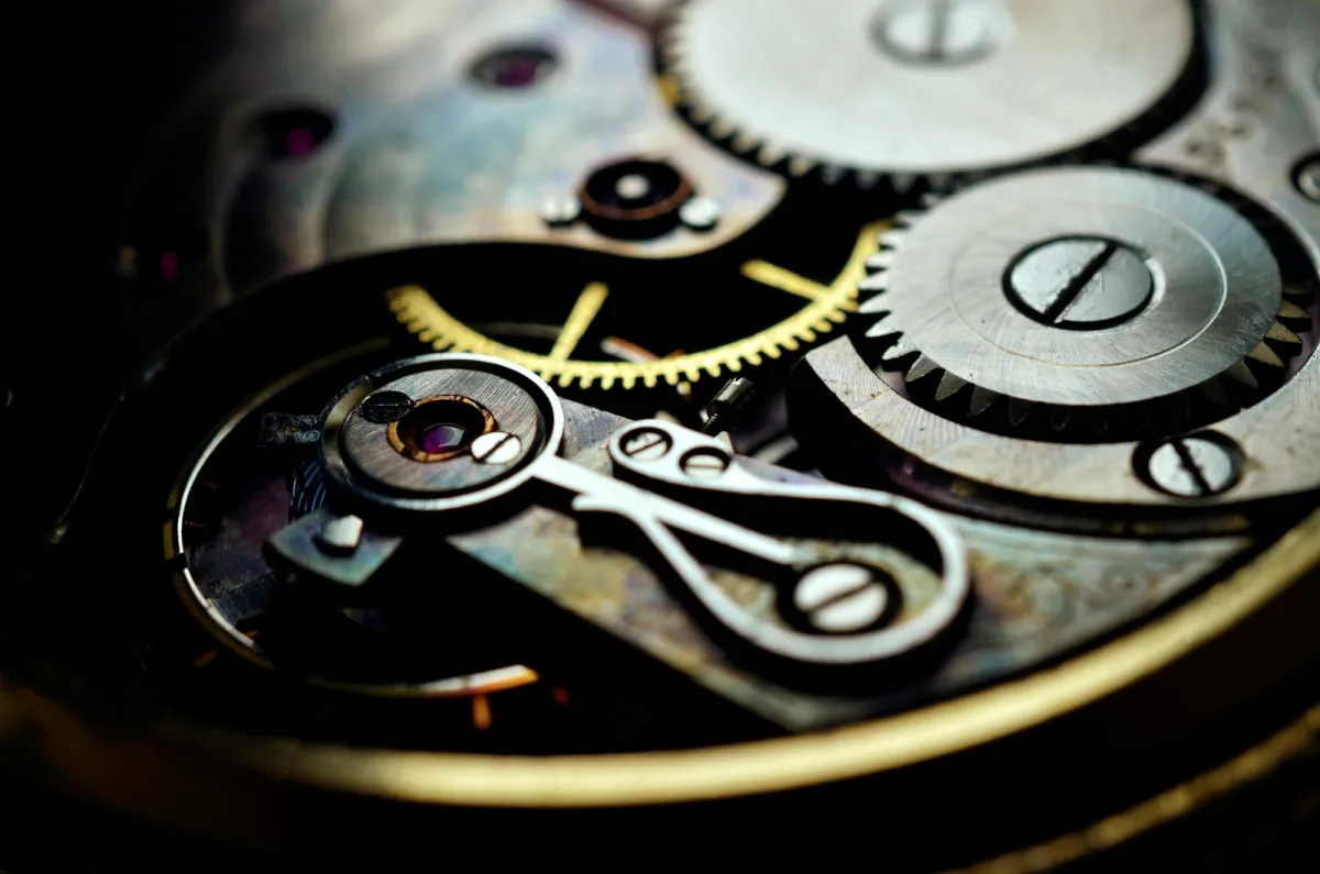 Close-up of the gears and screws inside a mechanical watch movement