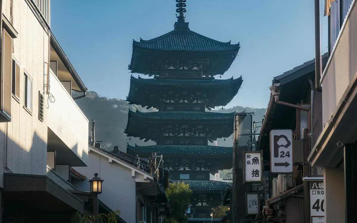 A narrow street in Kyoto with a five-storey pagoda at the end
