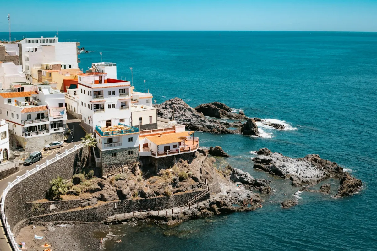 White houses on a rocky headland above the deep blue Atlantic at Los Gigantes, Tenerife White houses on a rocky headland above the deep blue Atlantic at Los Gigantes, Tenerife