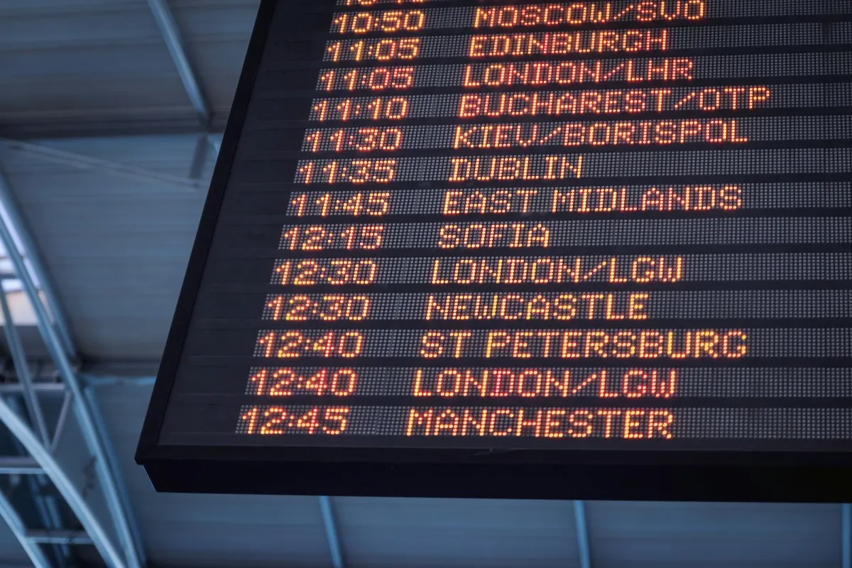 An airport departures board listing flights to London, Edinburgh, Manchester and Dublin An airport departures board listing flights to London, Edinburgh, Manchester and Dublin