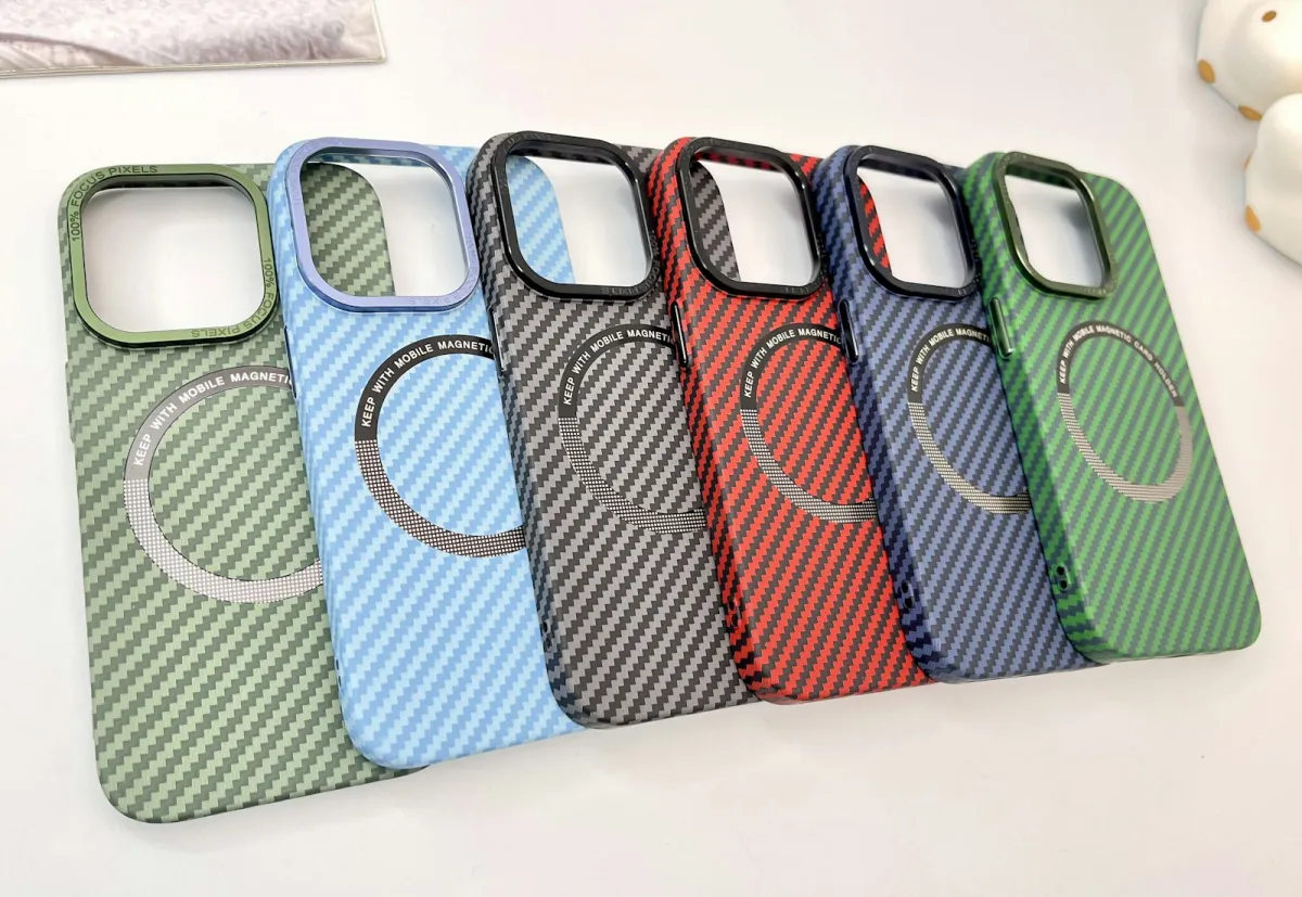 A row of colourful carbon-fibre-pattern magnetic phone cases on a white table A row of colourful carbon-fibre-pattern magnetic phone cases on a white table