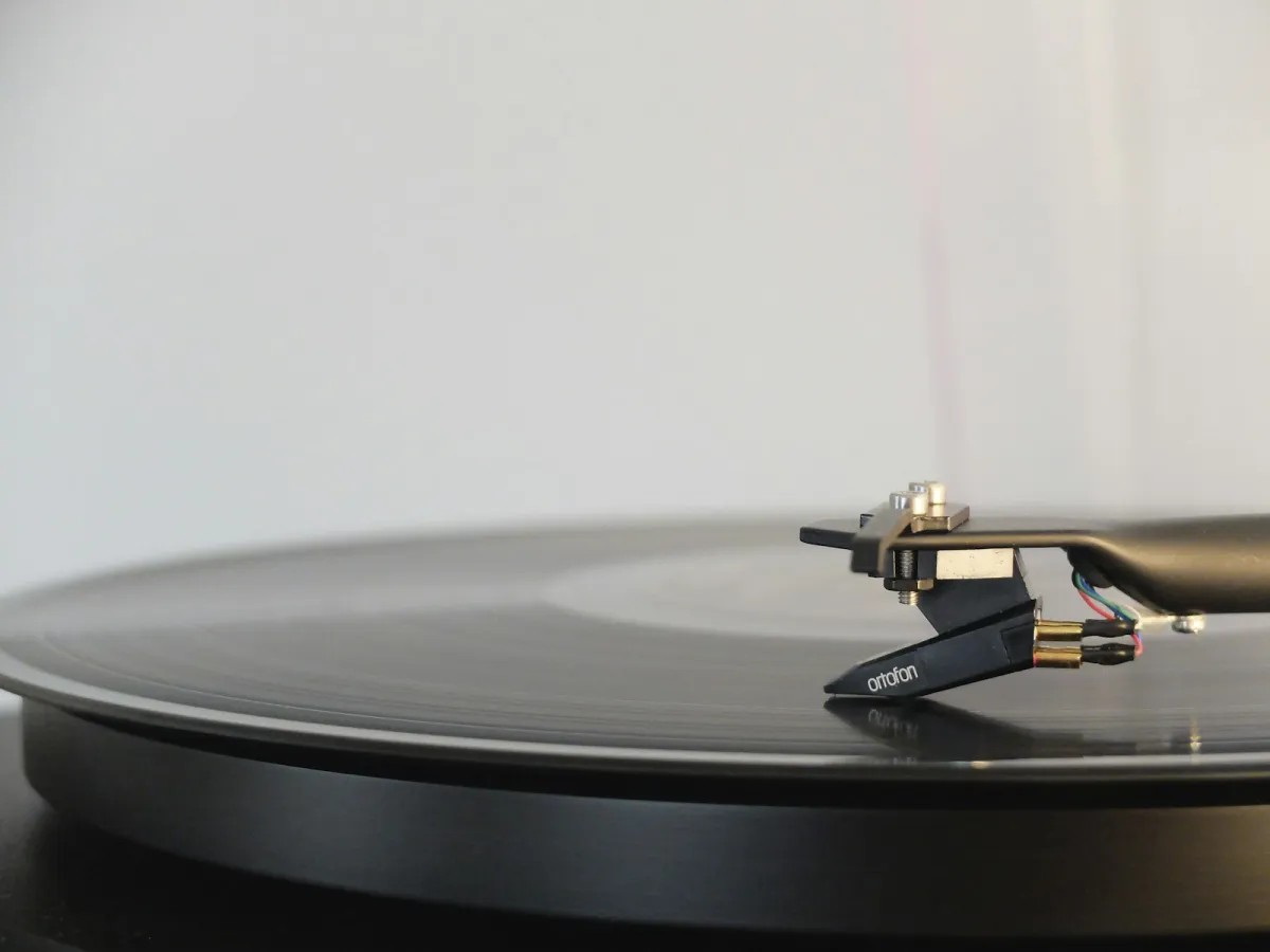 A black vinyl record on a turntable A black vinyl record on a turntable