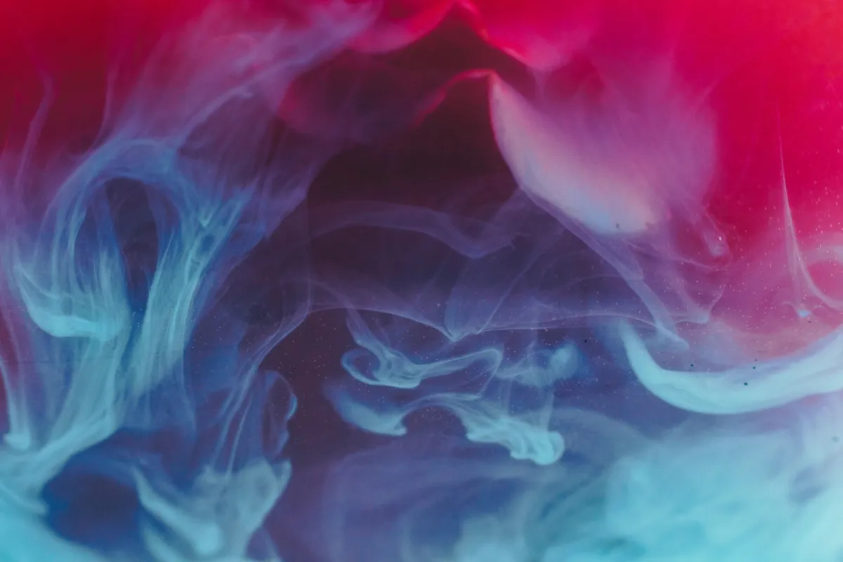 Abstract swirls of blue and red smoke