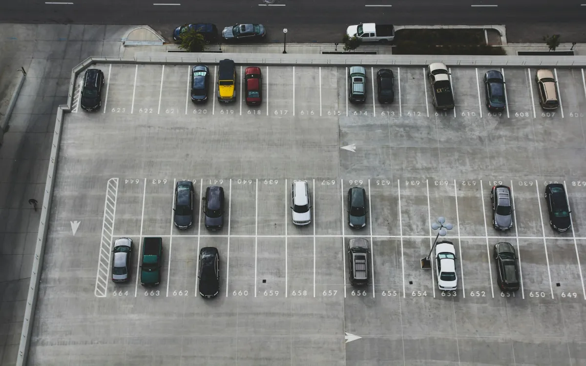 Aerial view of cars parked in numbered bays on a car park roof Aerial view of cars parked in numbered bays on a car park roof