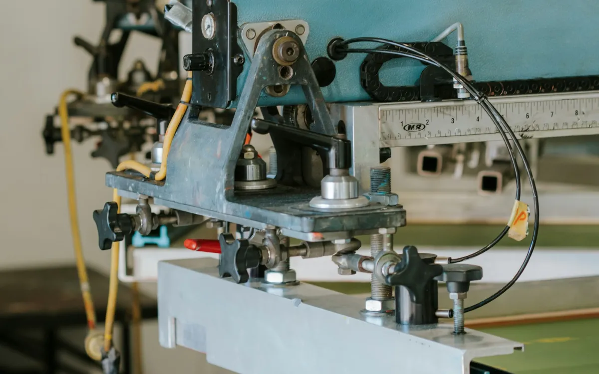 Close-up of a screen printing machine in a print workshop
