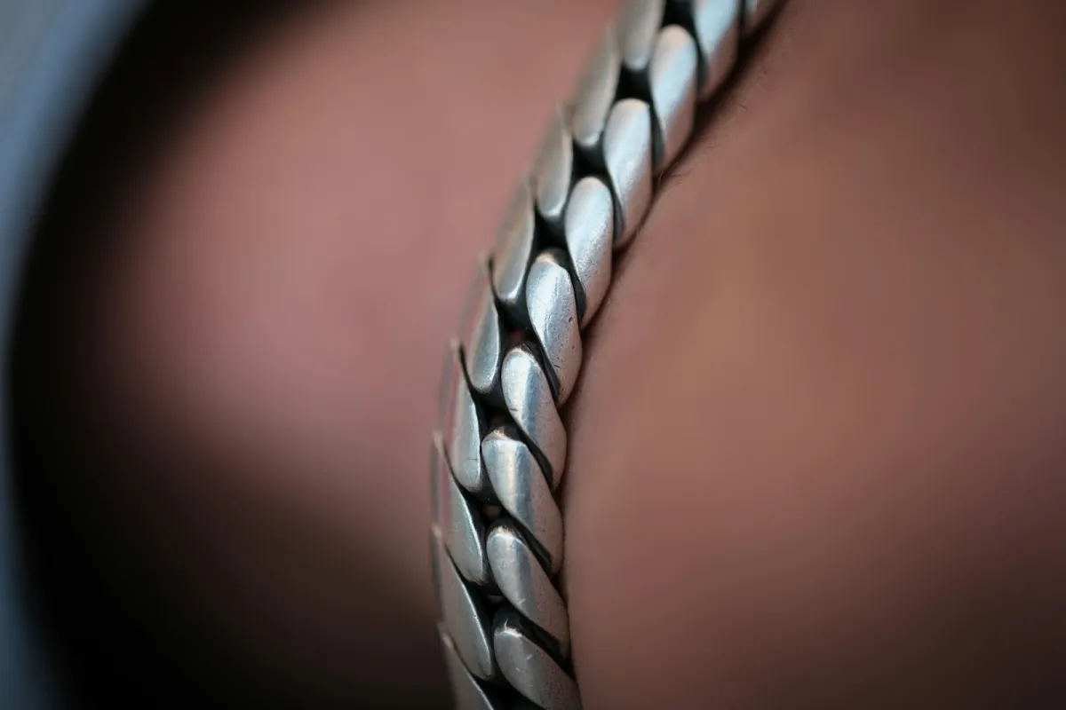 Close-up of a chunky sterling silver chain bracelet