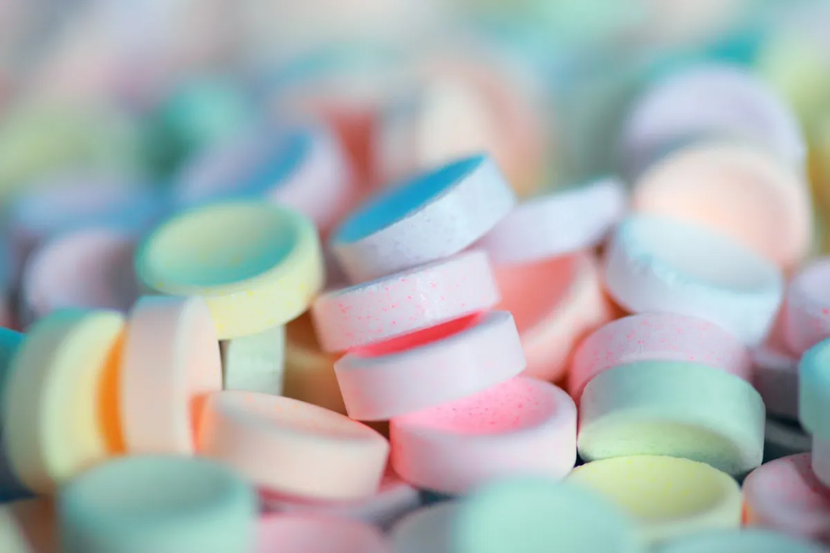 A pile of pastel-coloured round sweets