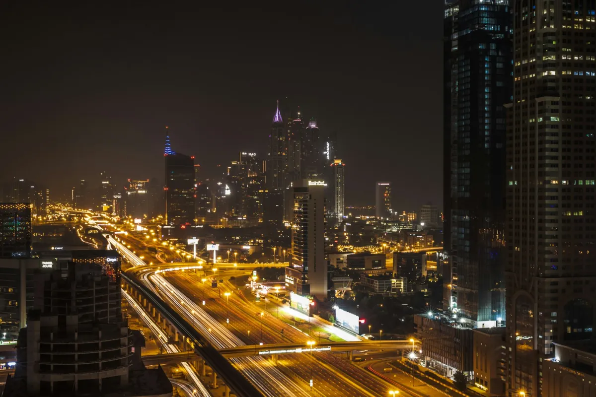 Sheikh Zayed Road in Dubai at night with light trails and skyscrapers Sheikh Zayed Road in Dubai at night with light trails and skyscrapers