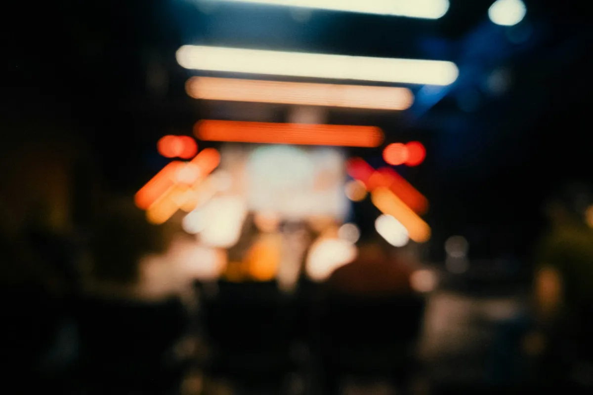 Blurred stage lights above a concert audience Blurred stage lights above a concert audience