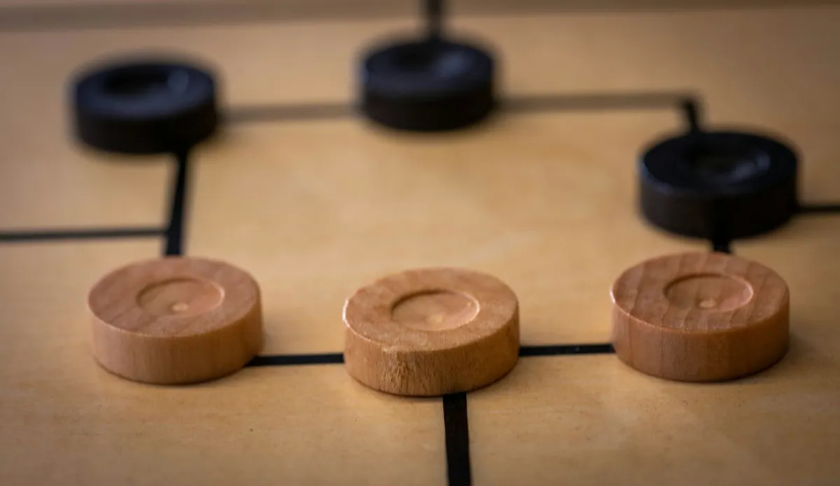 Wooden game discs on a wooden board Wooden game discs on a wooden board