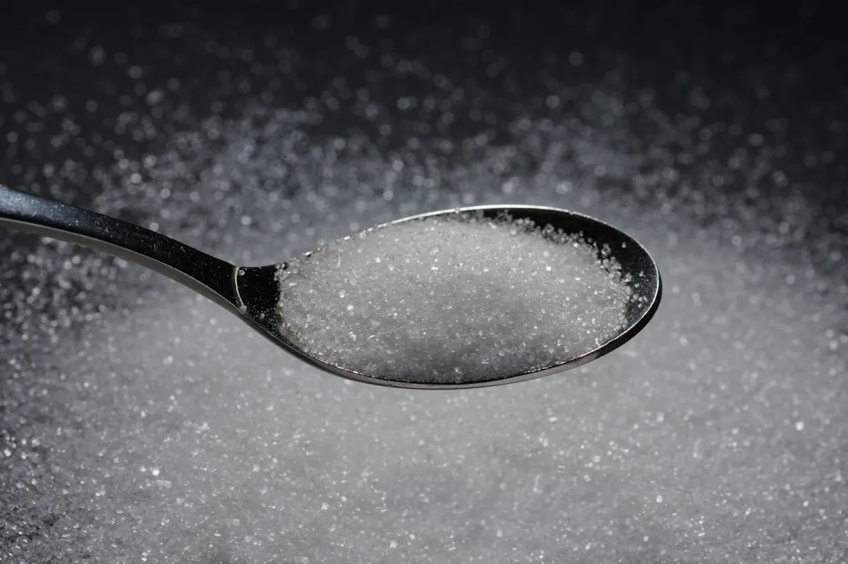 Spoonful of sweetener granules