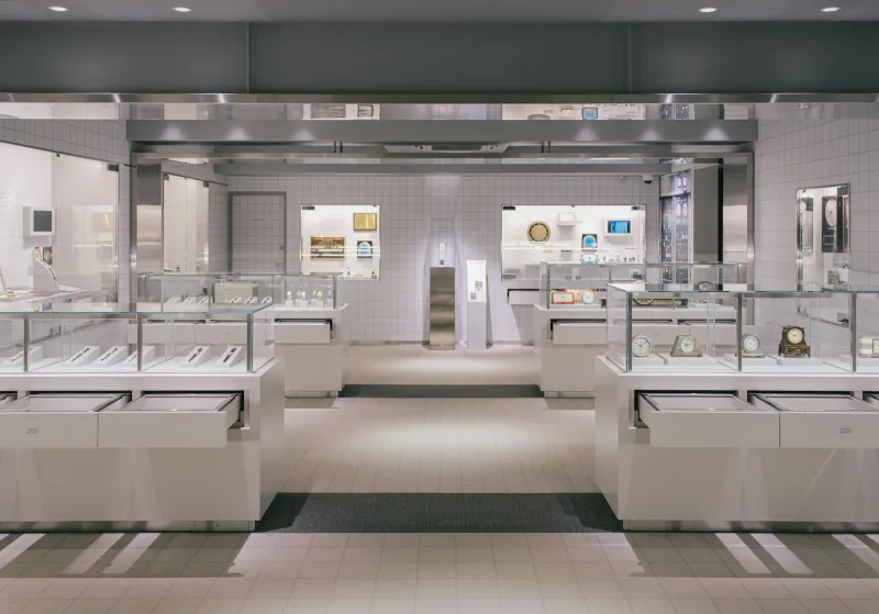 Lit glass display cases in a modern jewellery shop