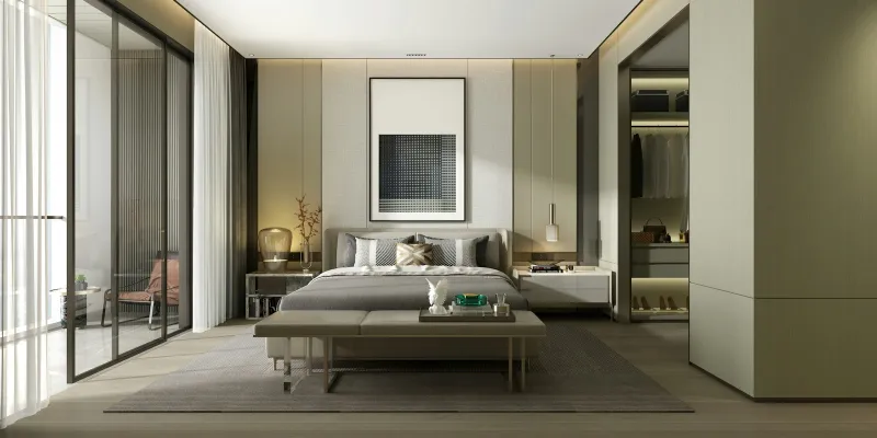 A modern bedroom with a grey upholstered bed, bench at its foot and a framed print above the headboard