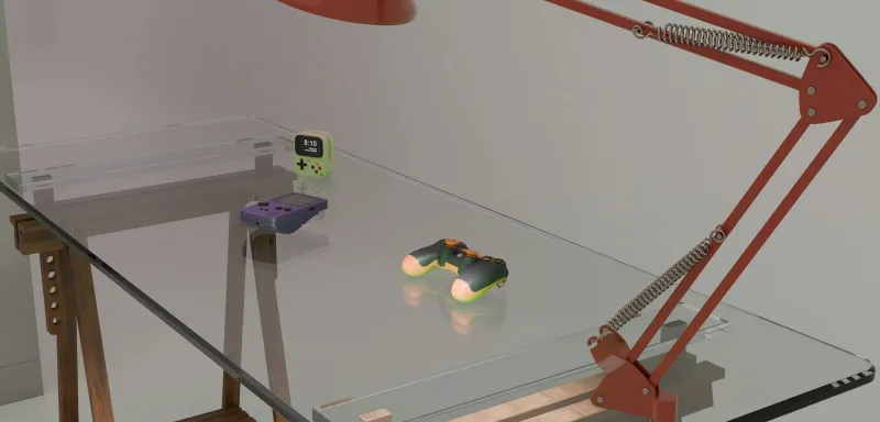 Game controllers and a handheld console on a glass desk beside a red lamp