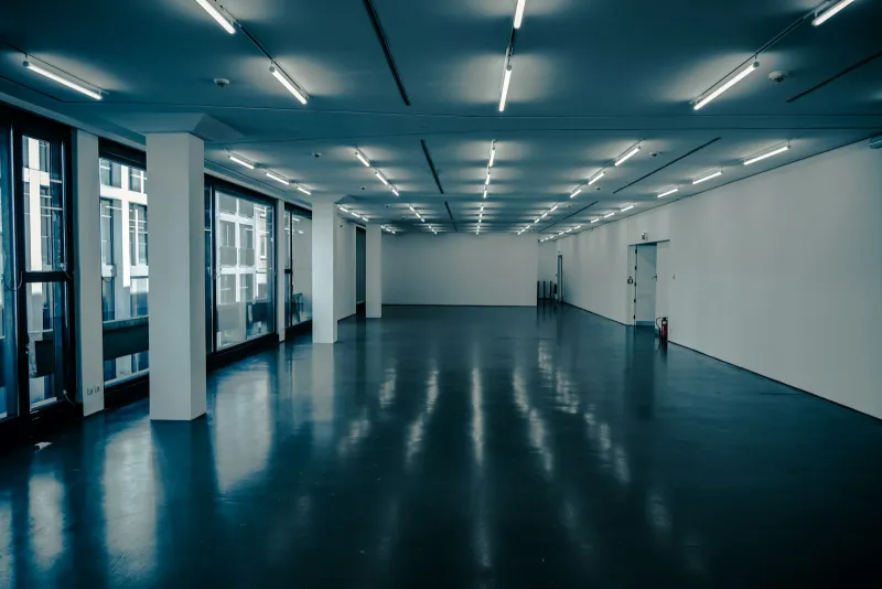 Display Wizard: roller banners, pop-up stands and signs from Lancashire Empty exhibition hall with polished floor and rows of ceiling lights