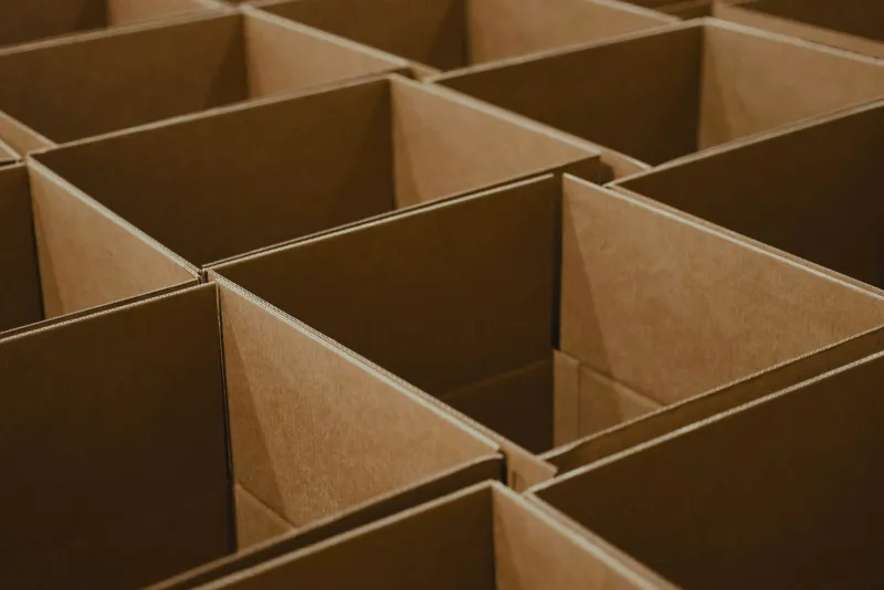 Rows of empty, open brown cardboard boxes packed tightly together