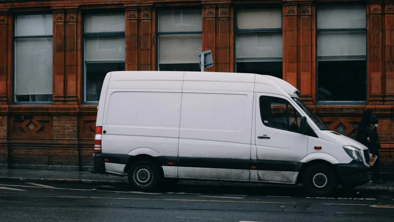 White delivery van parked on a street
