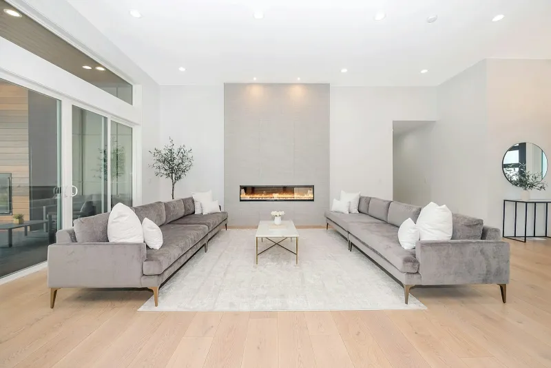 Furniture in Fashion: modern sofas, dining sets and TV units from Bolton Two grey velvet sofas facing each other in a bright modern living room
