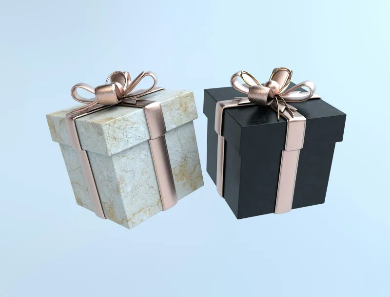 Two gift boxes, one marble-effect and one black, tied with rose-gold ribbons