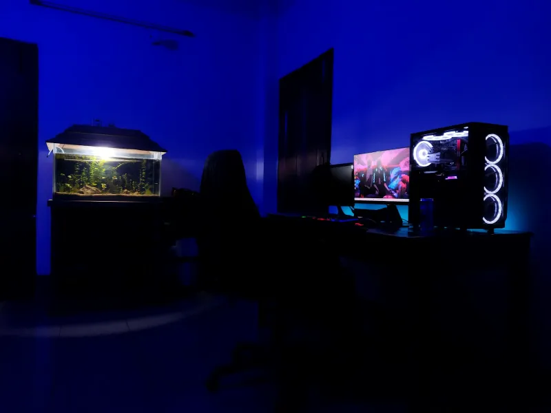 Hero Wars: a free fantasy RPG you can play in your browser A gaming PC and monitor glowing in a dark room lit in blue