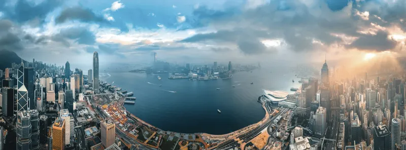 HopeGoo: flights, hotels and trains for China and Hong Kong trips Panoramic aerial view of the Hong Kong skyline around Victoria Harbour
