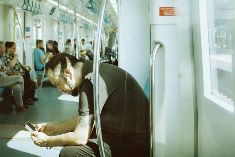 iD Mobile: fixed-price SIM only plans and phone deals from Currys A passenger looking at his phone on a busy train