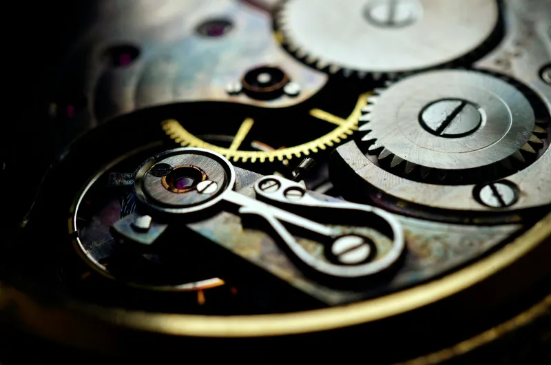 Close-up of the gears and screws inside a mechanical watch movement
