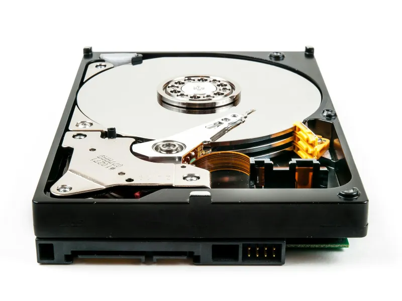 MiniTool: free partition, recovery and backup tools for Windows PCs An opened hard disk drive showing its platter and read arm