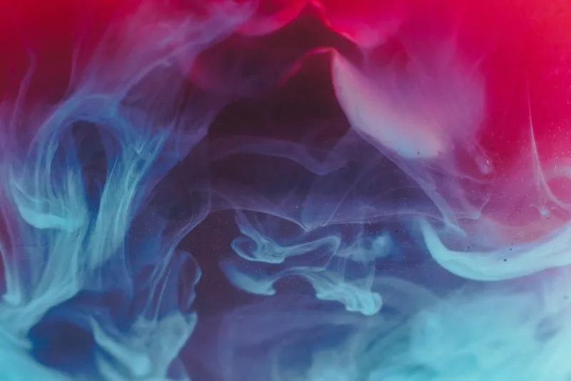 NVee: low-cost 10ml e-liquids, refillable kits and multi-buys Abstract swirls of blue and red smoke