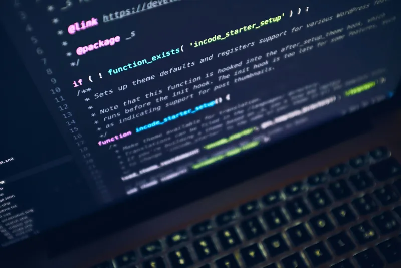 Parallels: run Windows on your Mac, with student and upgrade discounts Close-up of colourful code on a laptop screen above a backlit keyboard