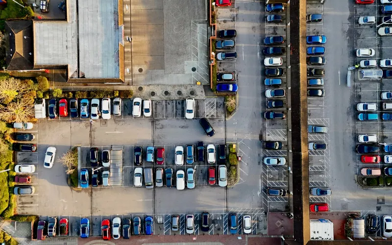 Park BCP: compare 100+ UK airport car parks, hotels and lounges Aerial view of a busy car park with rows of parked cars