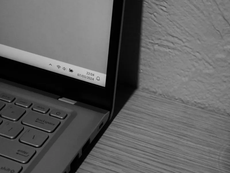 iolo: System Mechanic PC clean-up software and add-on privacy tools Close-up of a Windows laptop on a wooden surface
