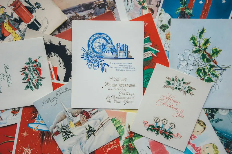 Scribbler: funny cards, Jellycat and Halloween treats, with buy 3 get 1 free Pile of vintage Christmas greeting cards spread on a table