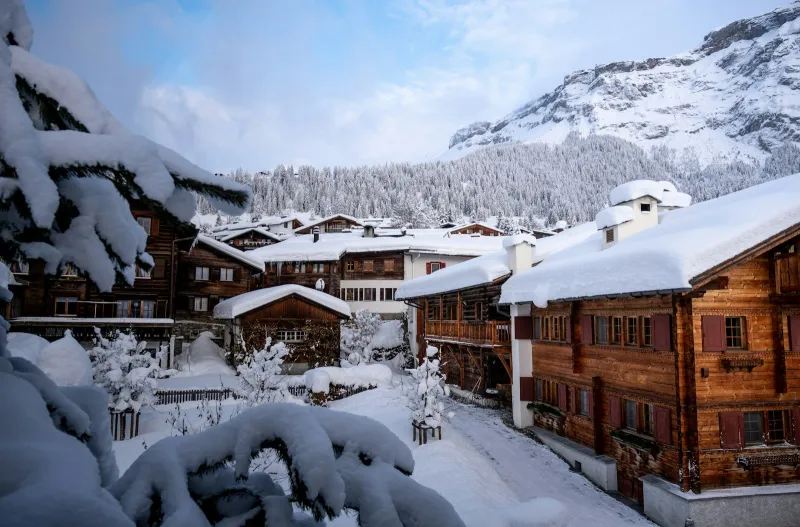 Wooden chalets in a snowy mountain village