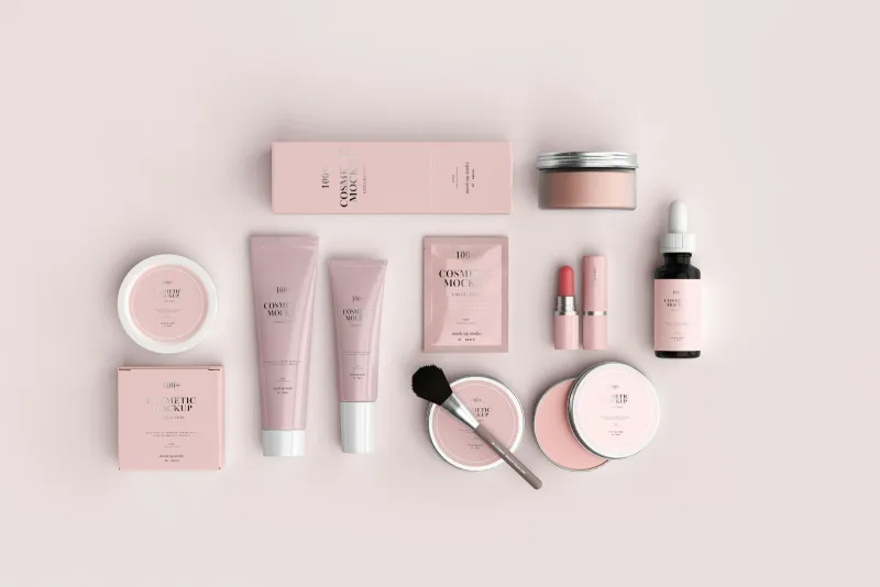 Superdrug store spotlight: advent calendar, fragrance savings and own-brand Pink cosmetic jars, tubes and a makeup brush laid out on a pale background