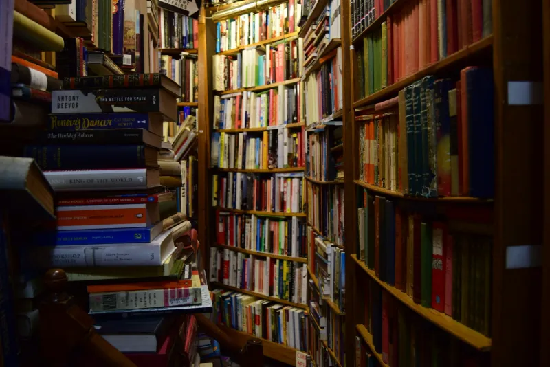Shelves and stacks of books in a bookshop