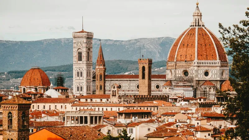Weekend in Italy: museum tickets and tours booked before you fly Florence Cathedral dome and Giotto's bell tower above the city's rooftops